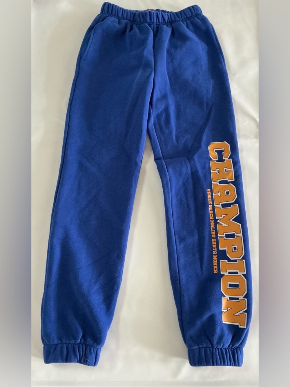 Edikted Royal Blue Sweatpants with yellow 'CHAMPION' Side Print